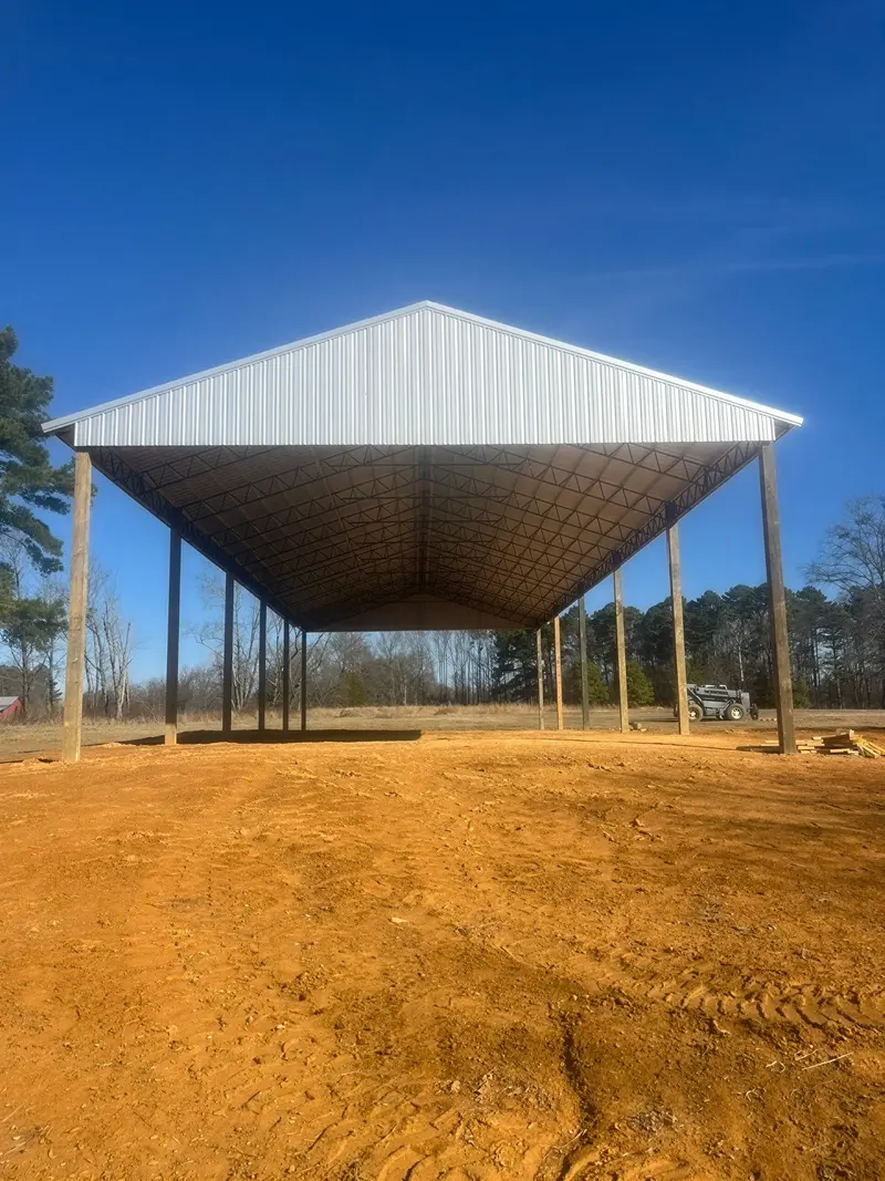 Open steel structure with a completed metal roof